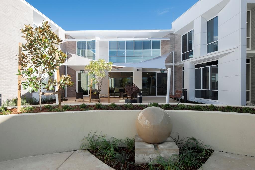 A modern and spacious courtyard at Whiddon Easton Park, an aged care home in Glenfield.